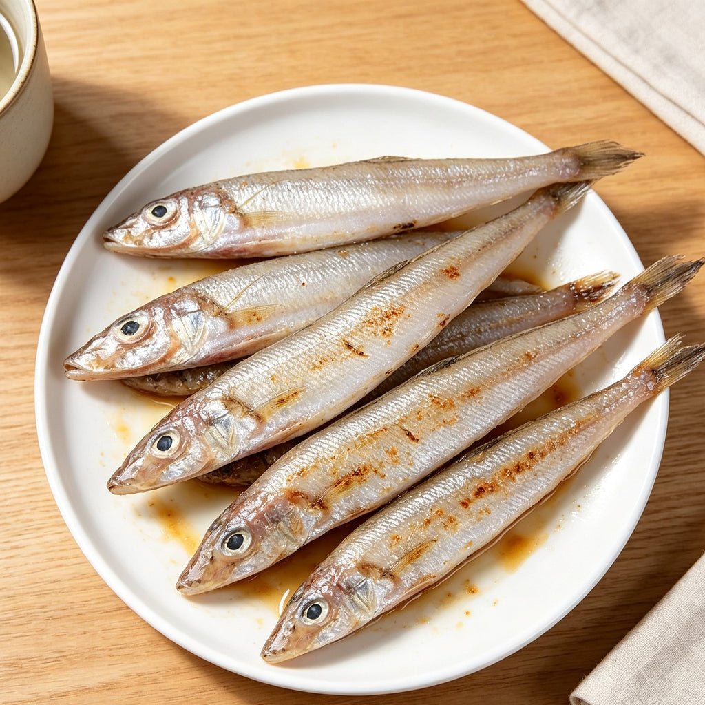 Pan-fried sea smelt arranged on a white plate